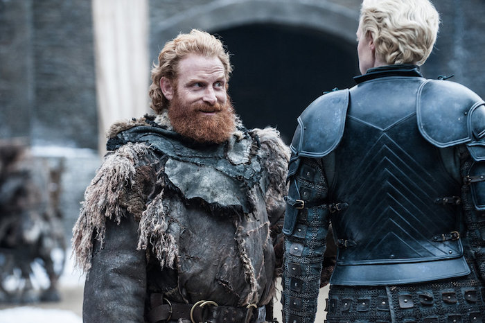 A still from Season 7 of Game Thrones with Tormund looking at Brienne of Tarth