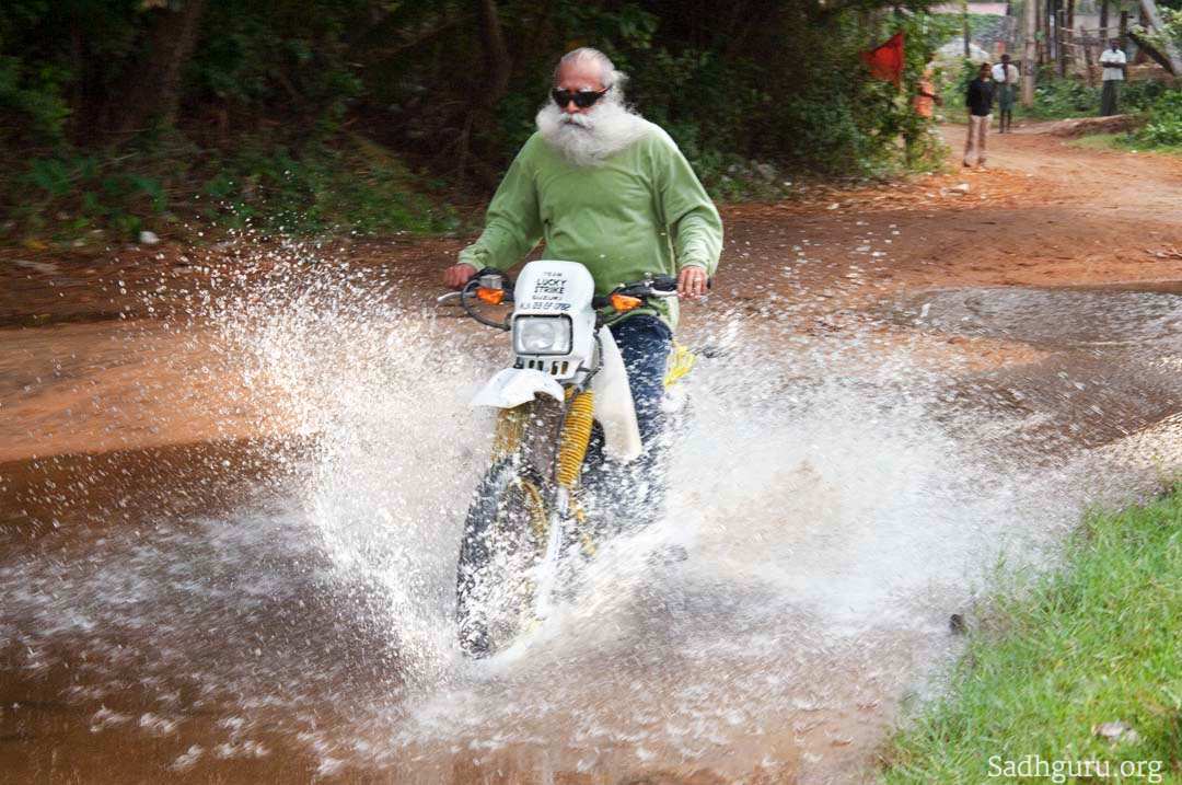 Sadhguru - riding on bike